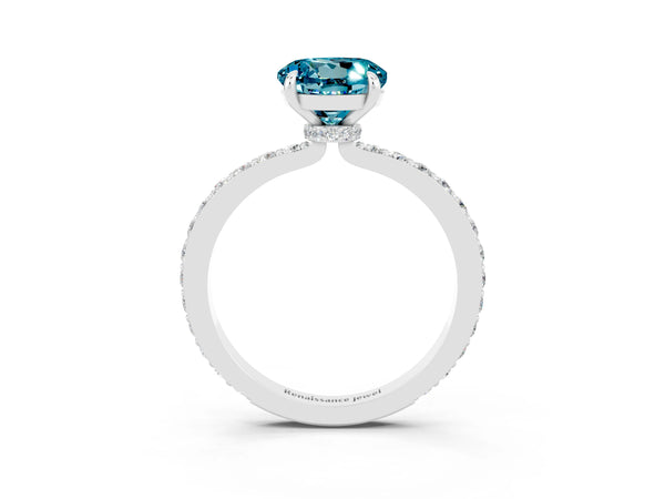 Platinum Round Cut Blue Topaz Solitaire Engagement Ring with Pavé Band and Four-Prong Setting
