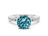 White gold Round Cut Blue Topaz Solitaire Pavé Band with Four-Prong Setting