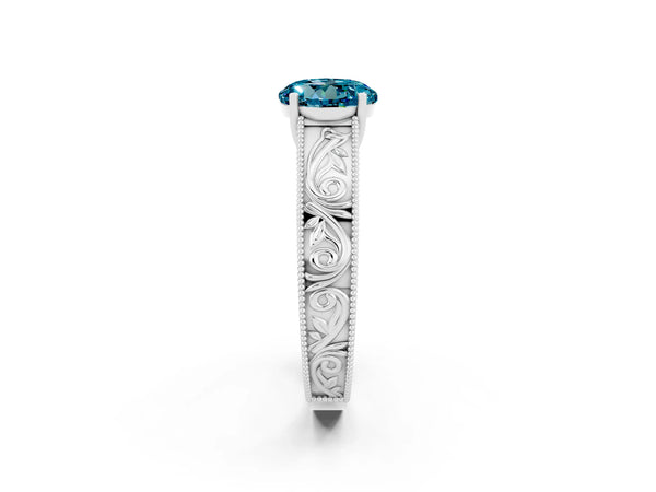 Silver Round Cut Blue Topaz Solitaire Ring with Engraved Band and Four-Prong Setting