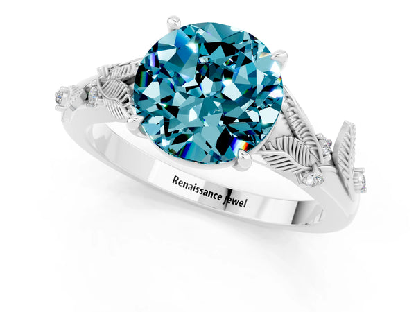 Silver Round Cut Blue Topaz Solitaire Ring with Leaf Motif Band and Four-Prong Setting