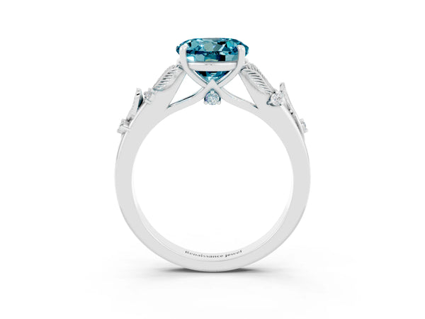 Platinum Round Cut Blue Topaz Solitaire Ring with Leaf Motif Band and Four-Prong Setting