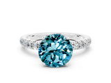 White gold Round Cut Blue Topaz Solitaire Ring with Pavé Accents and Four-Prong Setting