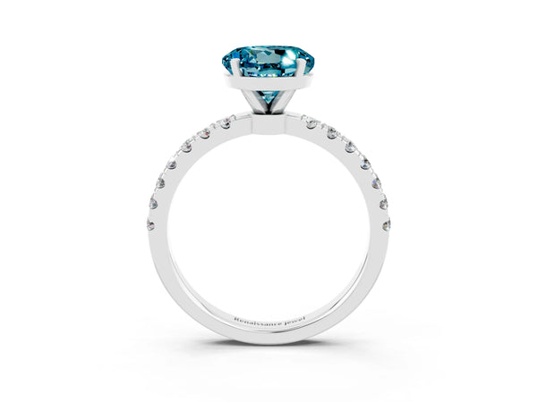 White gold Round Cut Blue Topaz Solitaire Ring with Pavé Accents and Four-Prong Setting