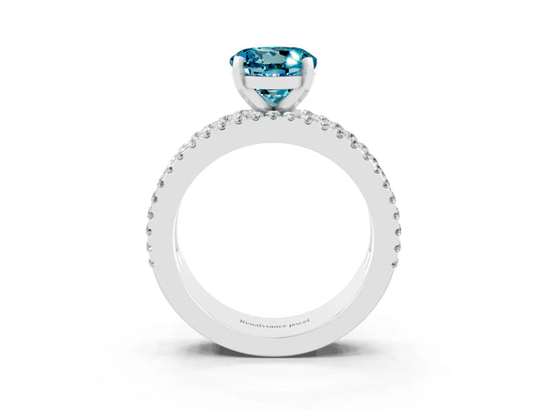 Platinum Round Cut Blue Topaz Solitaire Ring with Pavé and Channel Set Band