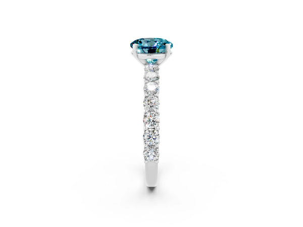 Silver Round Cut Blue Topaz Solitaire Ring with Shared Prong Pavé Band and Four-Prong Setting