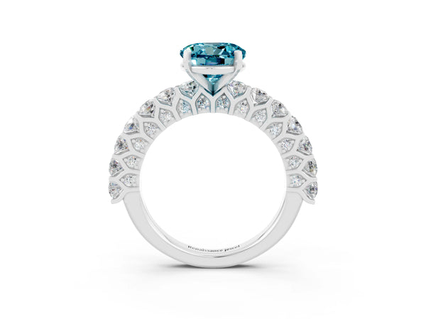 Silver Round Cut Blue Topaz Solitaire Ring with Shared Prong Pavé Band and Four-Prong Setting