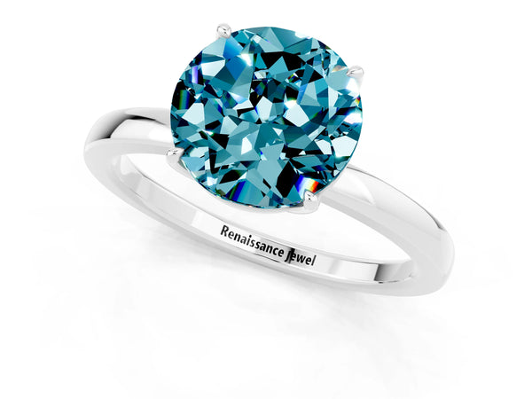 Platinum Round Cut Blue Topaz Solitaire Ring with Thin Band and Prong Setting