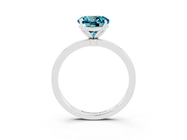 Platinum Round Cut Blue Topaz Solitaire Ring with Thin Band and Prong Setting