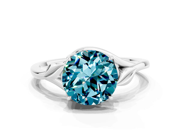 Silver Round Cut Blue Topaz Solitaire Ring with Twist Band and Four-Prong Setting