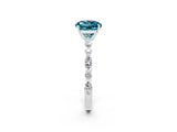 White gold Round Cut Blue Topaz Solitaire with Side Stones on a Pavé Band and Four-Prong Setting_2
