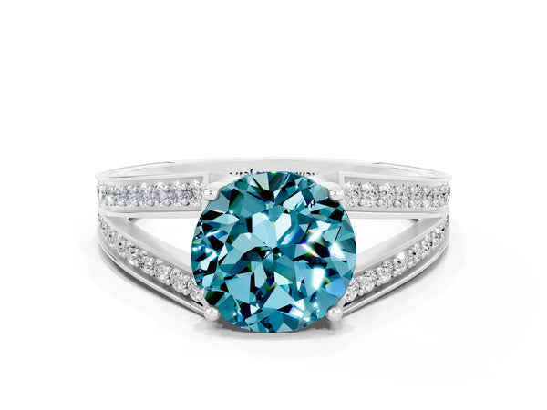 White gold Round Cut Blue Topaz Split Shank Ring with Pavé Band and Four-Prong Setting