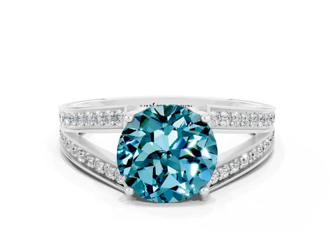 White gold Round Cut Blue Topaz Split Shank Ring with Pavé Band and Four-Prong Setting