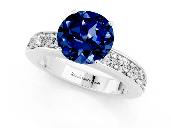 White gold Round Cut Blue Sapphire Engagement Ring with Channel Set Round Band and Prong Setting