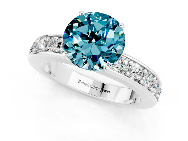 Platinum Round Cut Blue Topaz Engagement Ring with Channel Set Round Band and Prong Setting