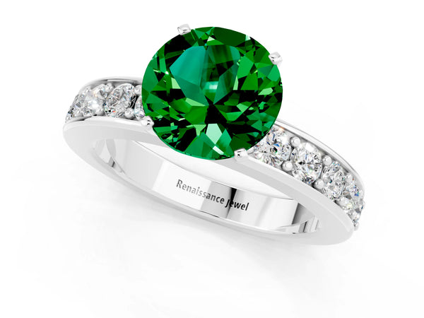 Platinum Round Cut Emerald Engagement Ring with Channel Set Round Band and Prong Setting