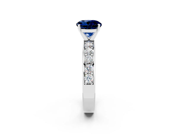 Silver Round Cut Blue Sapphire Engagement Ring with Channel Set Round Band and Prong Setting