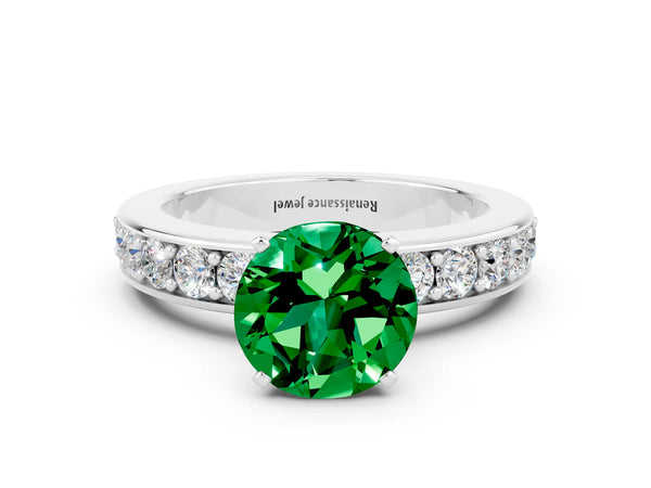 Platinum Round Cut Emerald Engagement Ring with Channel Set Round Band and Prong Setting