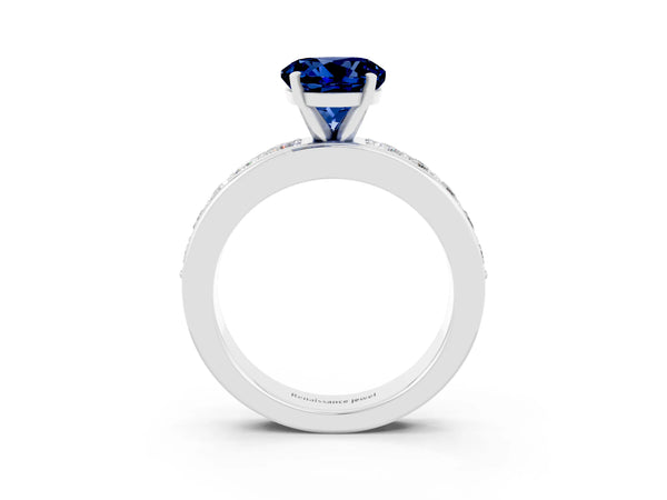 Silver Round Cut Blue Sapphire Engagement Ring with Channel Set Round Band and Prong Setting