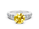 White gold Round Cut Cut Channel Set Diamond Engagement Ring with Four-Prong Setting