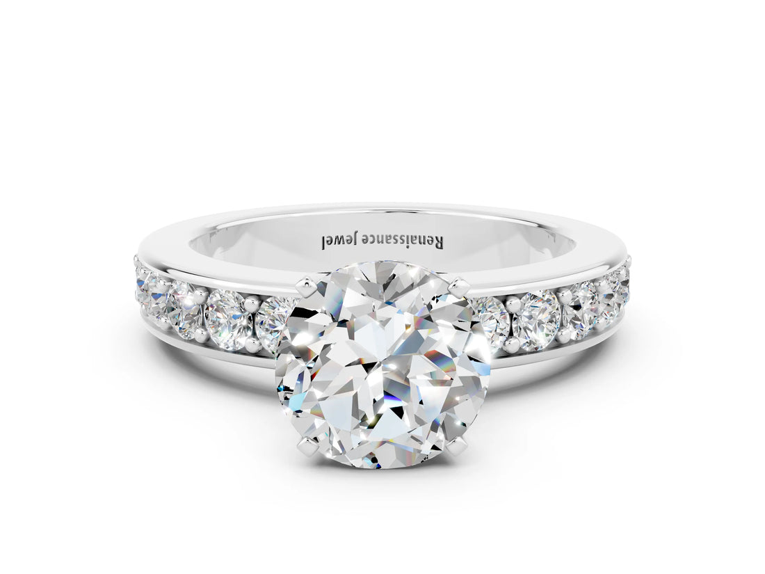 White gold Round Cut Cut Channel Set Diamond Engagement Ring with Four-Prong Setting