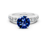 White gold Round Cut Cut Channel Set Diamond Engagement Ring with Four-Prong Setting