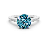 White gold Round Cut Cut Channel Set Solitaire Engagement Ring with Four-Prong Setting