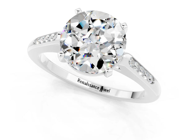 Platinum Round Cut Moissanite Solitaire Ring with Channel Set Round Band and Prong Setting