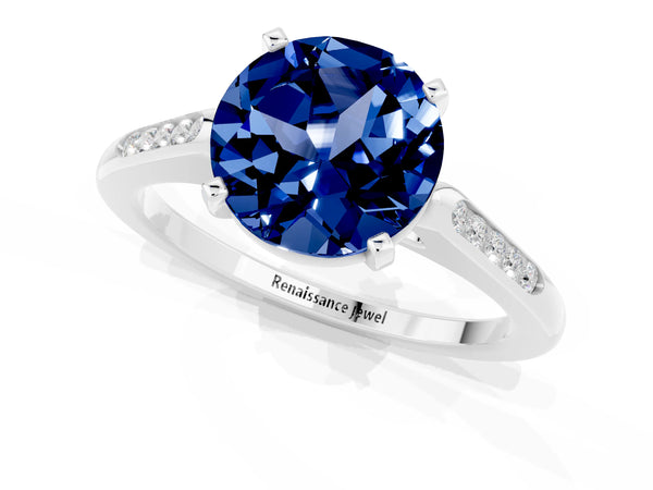Silver Round Cut Blue Sapphire Solitaire Ring with Channel Set Round Band and Prong Setting