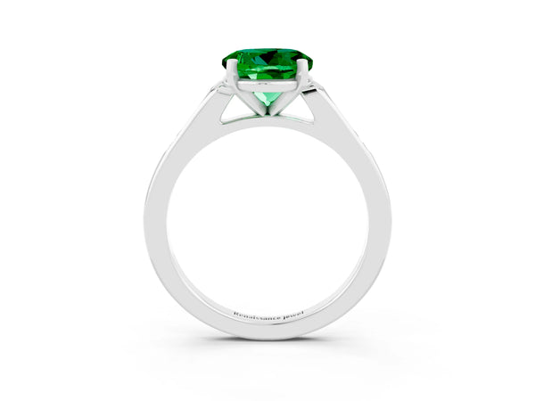 Platinum Round Cut Emerald Solitaire Ring with Channel Set Round Band and Prong Setting