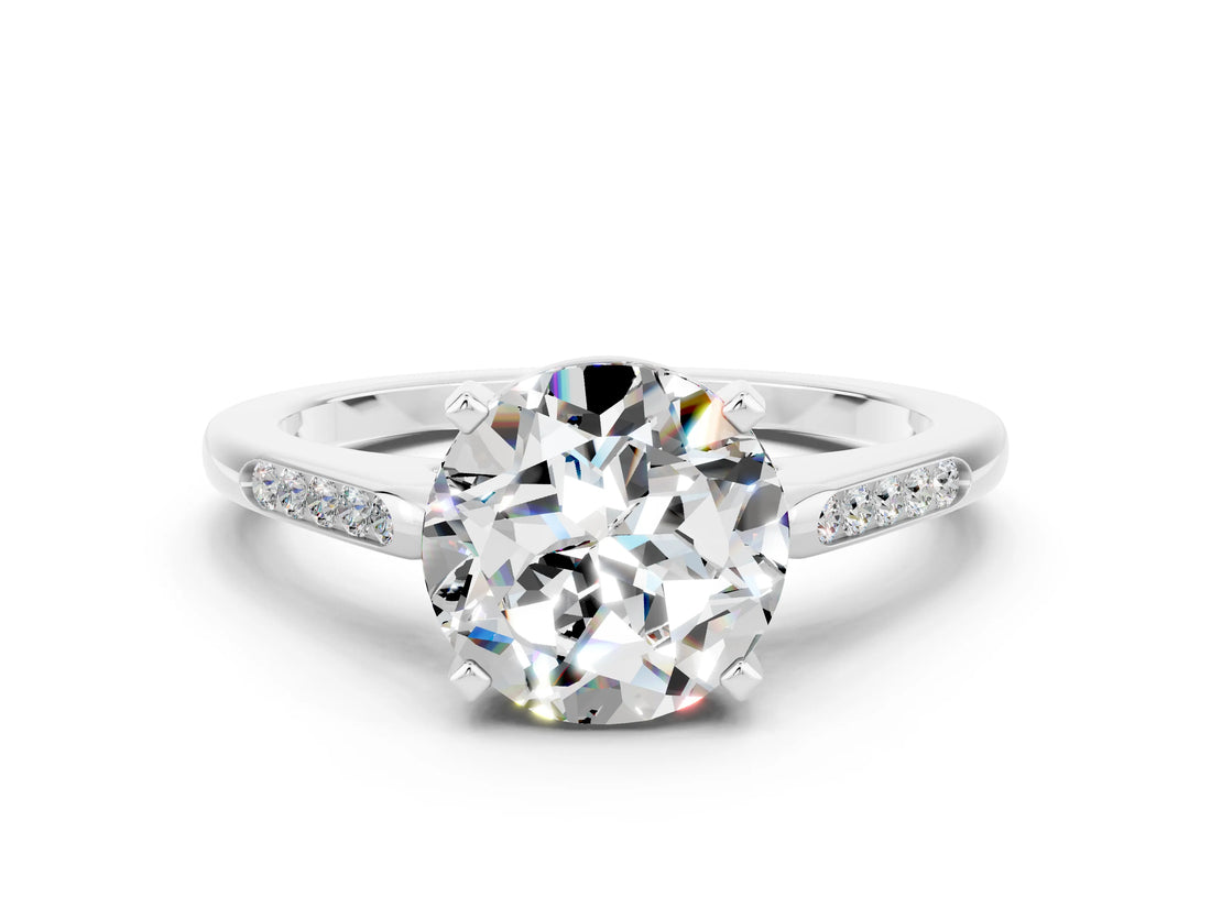 White gold Round Cut Cut Channel Set Solitaire Engagement Ring with Four-Prong Setting