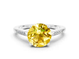 White gold Round Cut Cut Channel Set Solitaire Engagement Ring with Four-Prong Setting