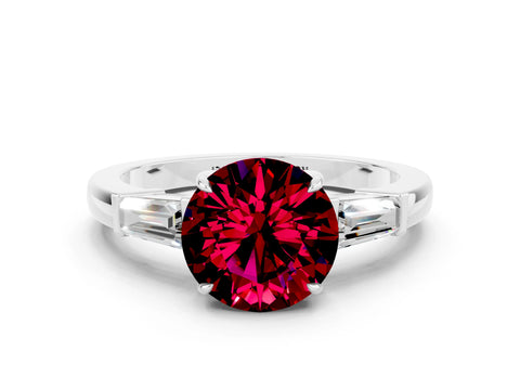 White gold Round Cut Cut Diamond Ring with Tapered Baguette Side Stones in Four-Prong Setting