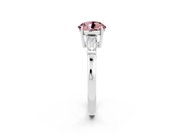 White gold Round Cut Cut Diamond Ring with Tapered Baguette Side Stones in Four-Prong Setting