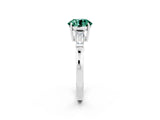 White gold Round Cut Cut Diamond Ring with Tapered Baguette Side Stones in Four-Prong Setting_2