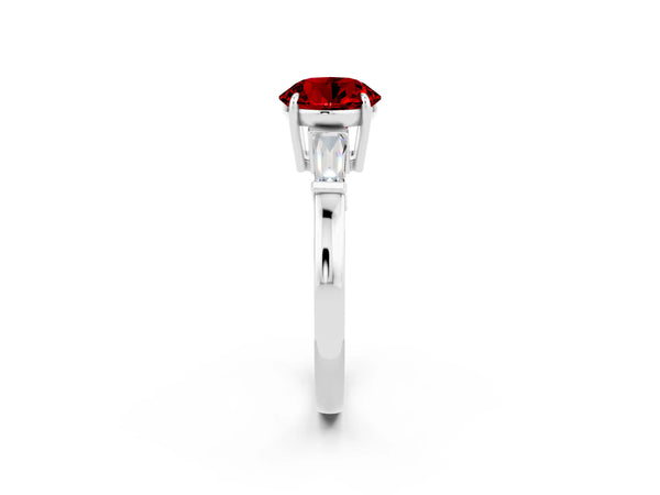 White gold Round Cut Cut Diamond Ring with Tapered Baguette Side Stones in Four-Prong Setting