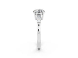 White gold Round Cut Cut Diamond Ring with Tapered Baguette Side Stones in Four-Prong Setting_2