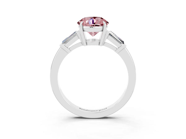 Platinum Round Cut Cut Diamond Ring with Tapered Baguette Side Stones in Four-Prong Setting