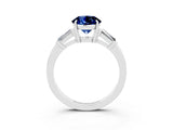 White gold Round Cut Cut Diamond Ring with Tapered Baguette Side Stones in Four-Prong Setting_3