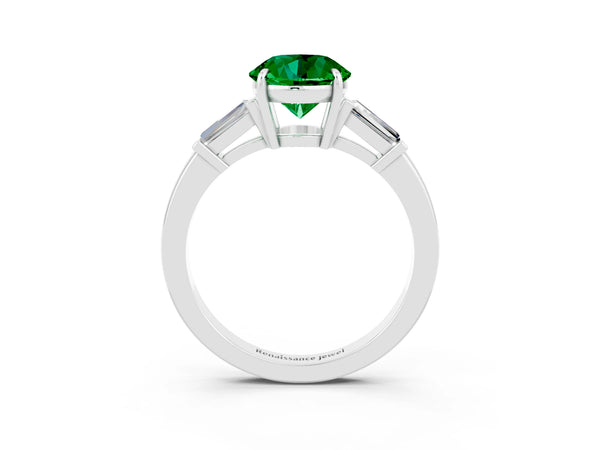 Platinum Round Cut Emerald Three-Stone Ring with Tapered Baguette Side Stones and Prong Setting