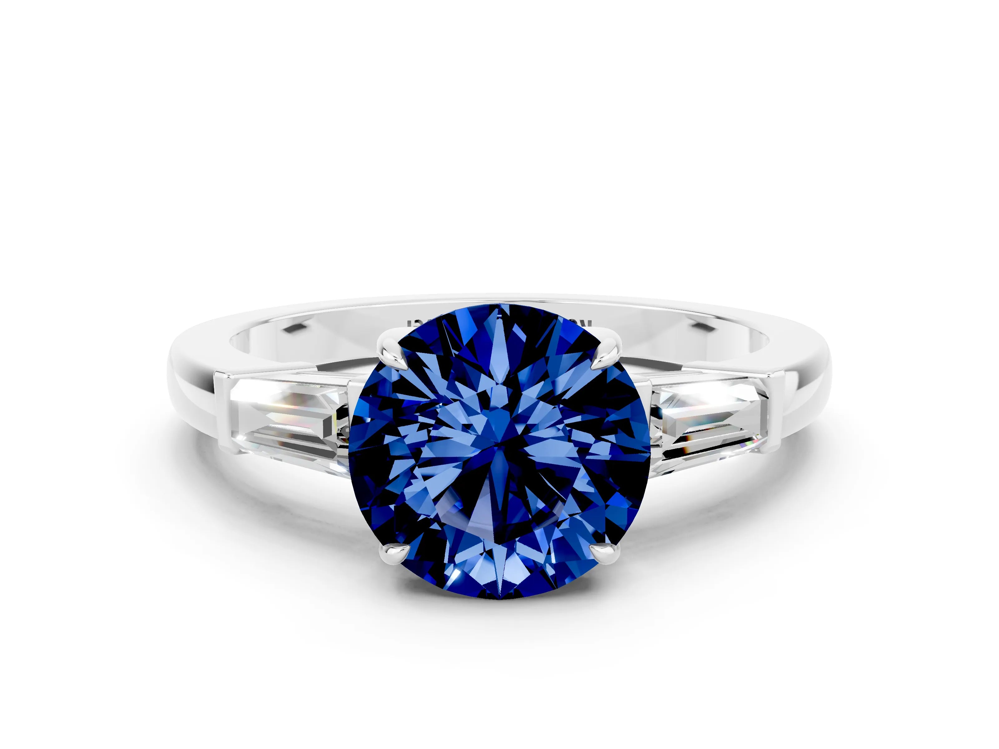 White gold Round Cut Cut Diamond Ring with Tapered Baguette Side Stones in Four-Prong Setting