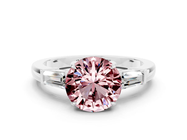White gold Round Cut Cut Diamond Ring with Tapered Baguette Side Stones in Four-Prong Setting