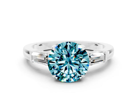 White gold Round Cut Cut Diamond Ring with Tapered Baguette Side Stones in Four-Prong Setting