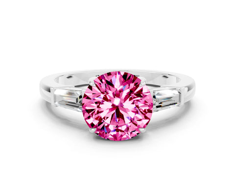 White gold Round Cut Cut Diamond Ring with Tapered Baguette Side Stones in Four-Prong Setting