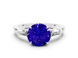 White gold Round Cut Cut Diamond Ring with Tapered Baguette Side Stones in Four-Prong Setting