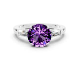 White gold Round Cut Cut Diamond Ring with Tapered Baguette Side Stones in Four-Prong Setting