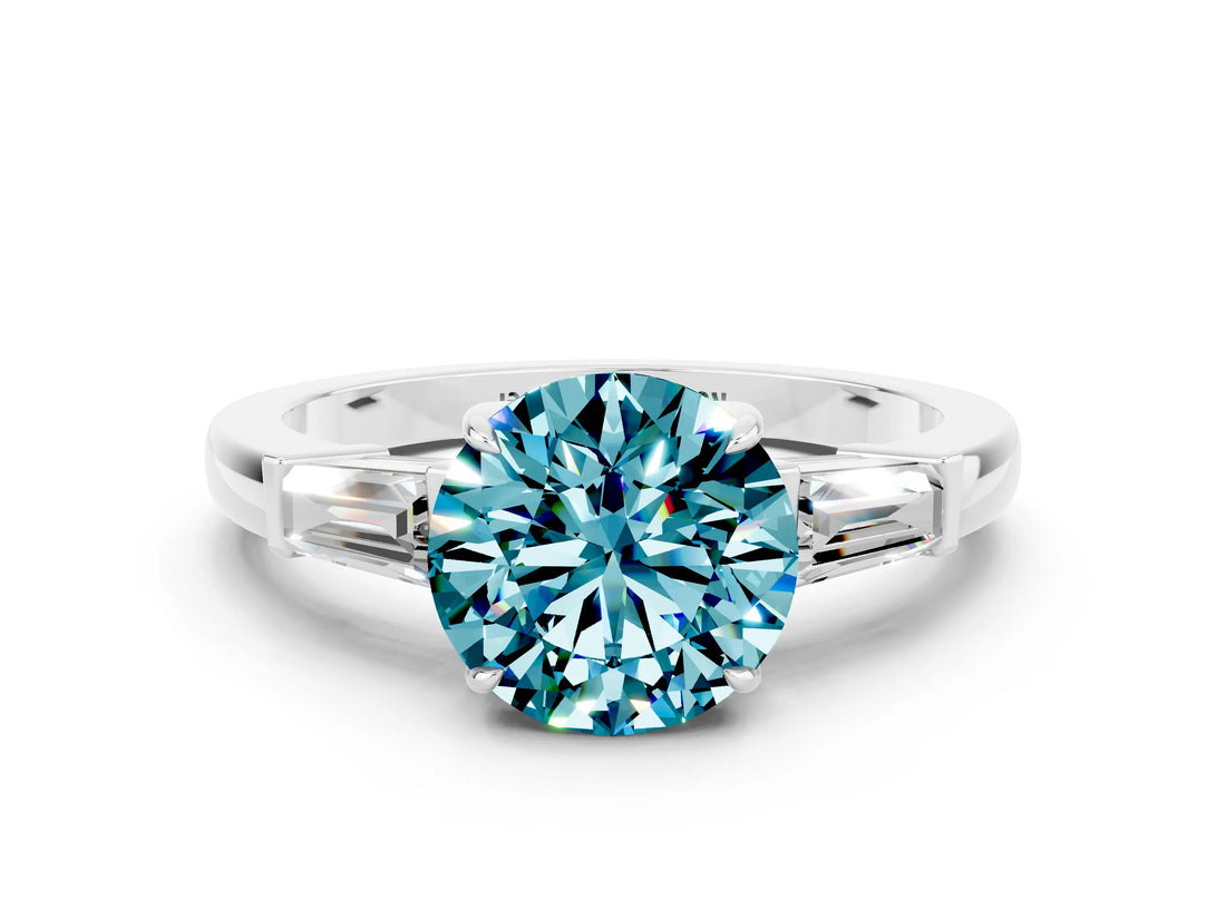 White gold Round Cut Cut Diamond Ring with Tapered Baguette Side Stones in Four-Prong Setting