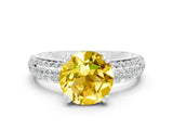 White gold Round Cut Cut Pave Diamond Engagement Ring with Channel Set Band and Four-Prong Setting