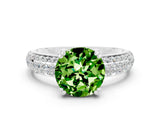 White gold Round Cut Cut Pave Diamond Engagement Ring with Channel Set Band and Four-Prong Setting