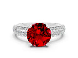 White gold Round Cut Cut Pave Diamond Engagement Ring with Channel Set Band and Four-Prong Setting