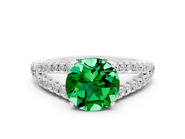 Platinum Round Cut Emerald Split Shank Engagement Ring with Round Pavé and Prong Setting